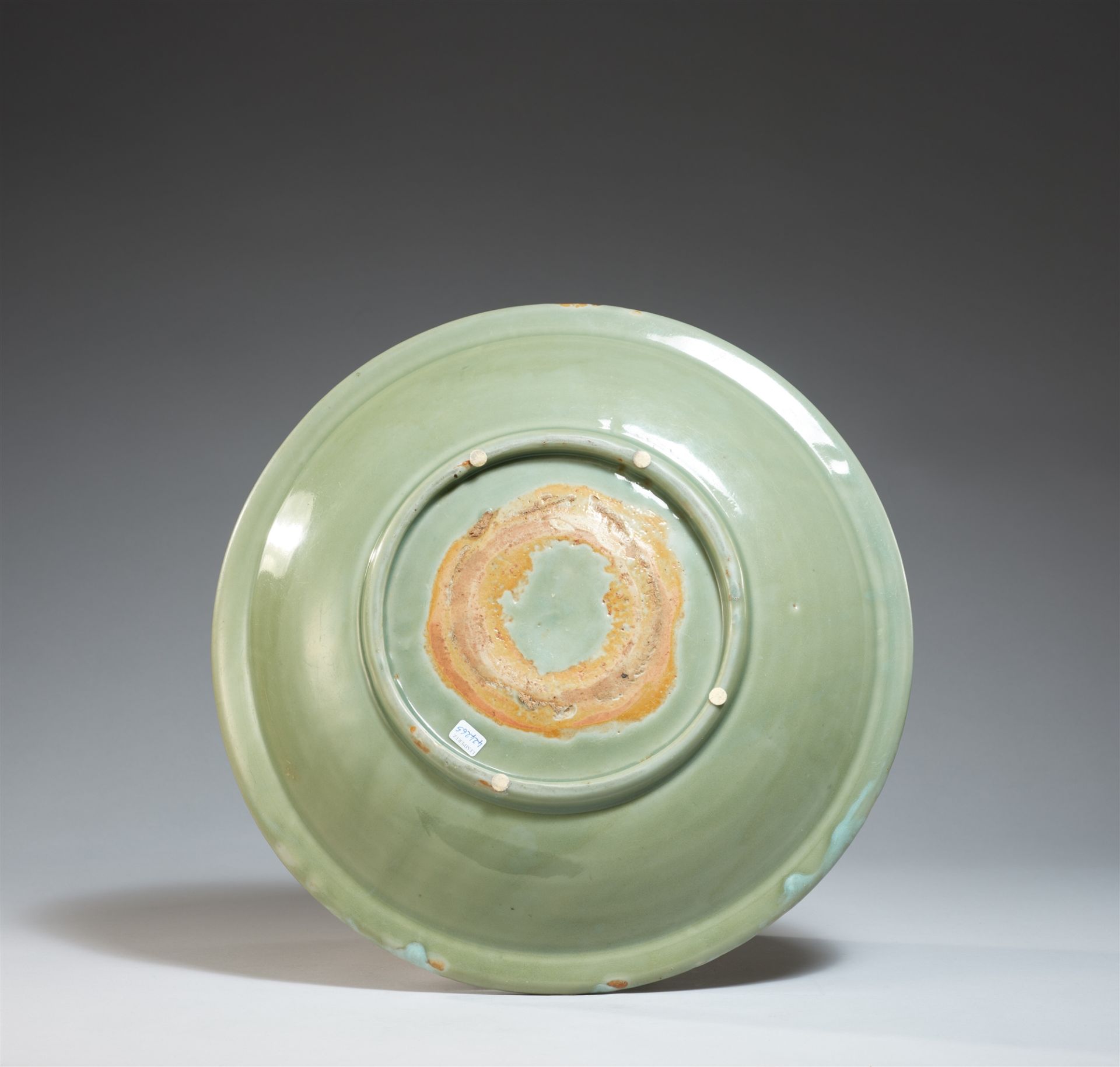 A large celadon charger. Ming dynasty, late 14th/early 15th century - Image 2 of 2