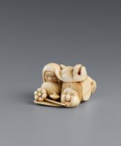 An ivory netsuke of a group of toys. Second half 19th century