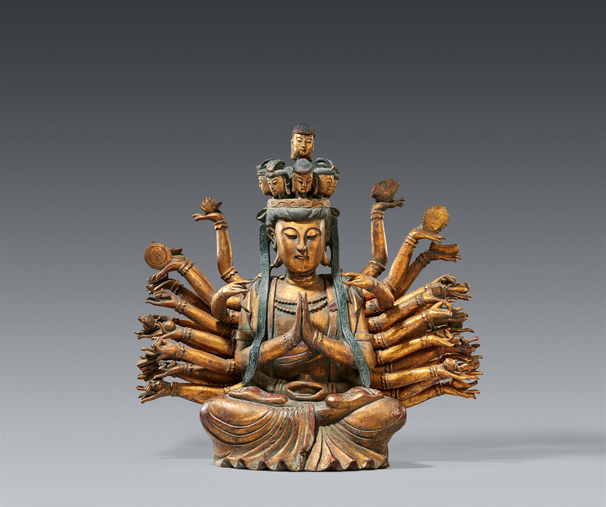 A lacquered wood figure of a Thousand Arm Guanyin. Qing dynasty, 19th century