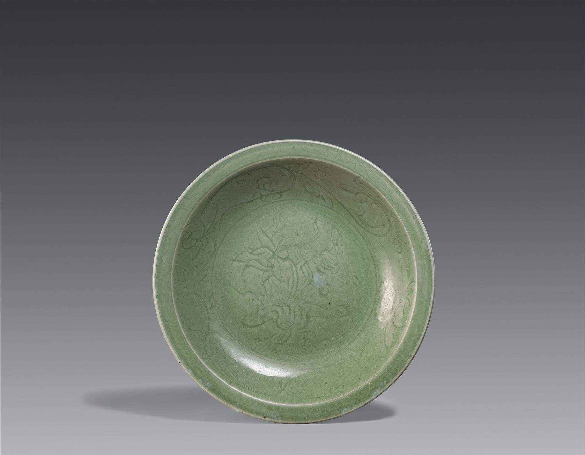A large celadon charger. Ming dynasty, late 14th/early 15th century