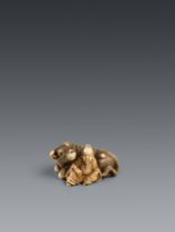 An ivory netsuke of a Chinese scholar sitting next to an ox. 19th century