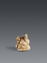 An ivory shunga netsuke of an Okame with a mask. 19th century