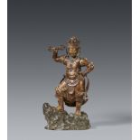 A polychromed and lacquered bronze figure of a guardian deity. Late Edo/early Meiji period