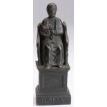 Dark bronze figurine depicting Saint Peter sitting on the Roman throne