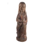 "Praying Saint". Carved and polychromed wooden sculpture. Romanesque. 13th century.