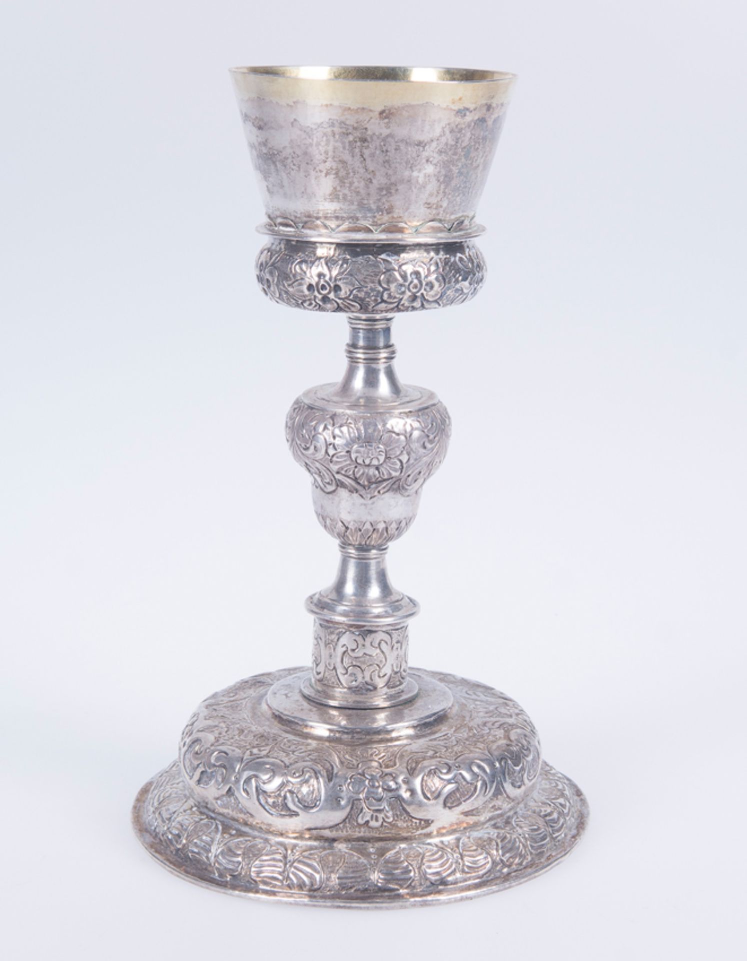 Embossed and chased silver chalice with a silver vermeil interior. Possibly Mexican. Late 16th cent