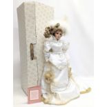 A large doll by Franklin Heirloom Dolls, "Kristina." The First Annual Gibson Girl Christmas Heirloom