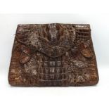A crocodile skin purse. 23.5x16cm