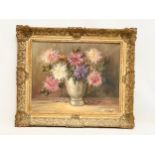 A vintage Still Life oil painting in gilt frame. Signed. Painting measures 49x39cm. Frame 66x56cm