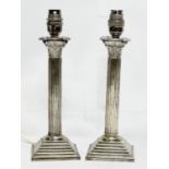 A pair of good quality early 20th century silver plated lamps with Corinthian style pillars. 29cm.