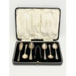 Sterling silver spoons and tongs in case. Birmingham. Case measures 19.5x15cm.