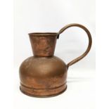 An early 20th century copper jug. 28x25cm