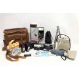 A quantity of cameras, including Kodak, Olympus Trip 35. With camera accessories, film, flash cubes,