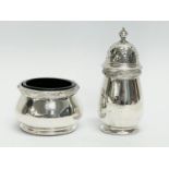 A 2 piece silver condiment set. 58 grams without liner.