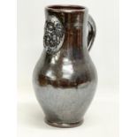 A large vintage salt glazed pottery jug. 21x30cm.