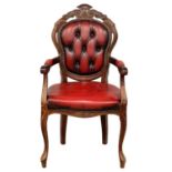 An ox-blood leather Italian style chair.