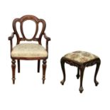 An Irish Chippendale style footstool and a Victorian style mahogany balloon back chair.