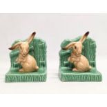 A pair of Sylvac pottery bookends. 11x11cm