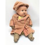 A 1930s Armand Marseille baby doll, marked A. M. Germany. 51cm
