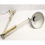 A vintage wall hanging anglepoise lamp