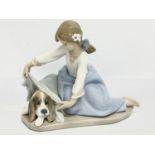 A Lladro figurine ‘Dog’s Best friend’ 18x16cm