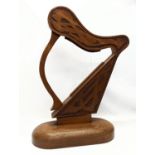 A large carved walnut ornamental harp with Celtic engraving. 75.5x48cm