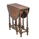 A good quality early 20th century oak drop leaf table. Closed 28x64x69cm. Open 86x64x69cm.