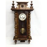 A Victorian Spring Vienna wall clock. 42.5x81.5cm