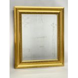 A gilt framed bevelled mirror. 55x65.5cm.