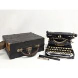 An early 20th century miniature Corona typewriter, dated 1917.