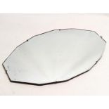 A 1930s bevelled mirror. 56x33cm