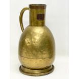 A large 19th century brass jug. Stamped E. Tits and T. Vaks. 26x41cm