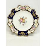 A late 19th century Royal Crown Derby Botanical gilt porcelain plate. Circa 1893. 22cm