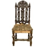 A late 19th century Jacobean style carved oak side chair. Circa 1890.