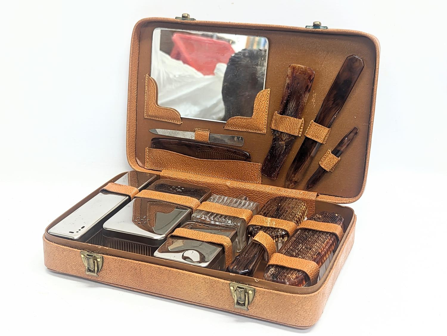 A vintage vanity set in case