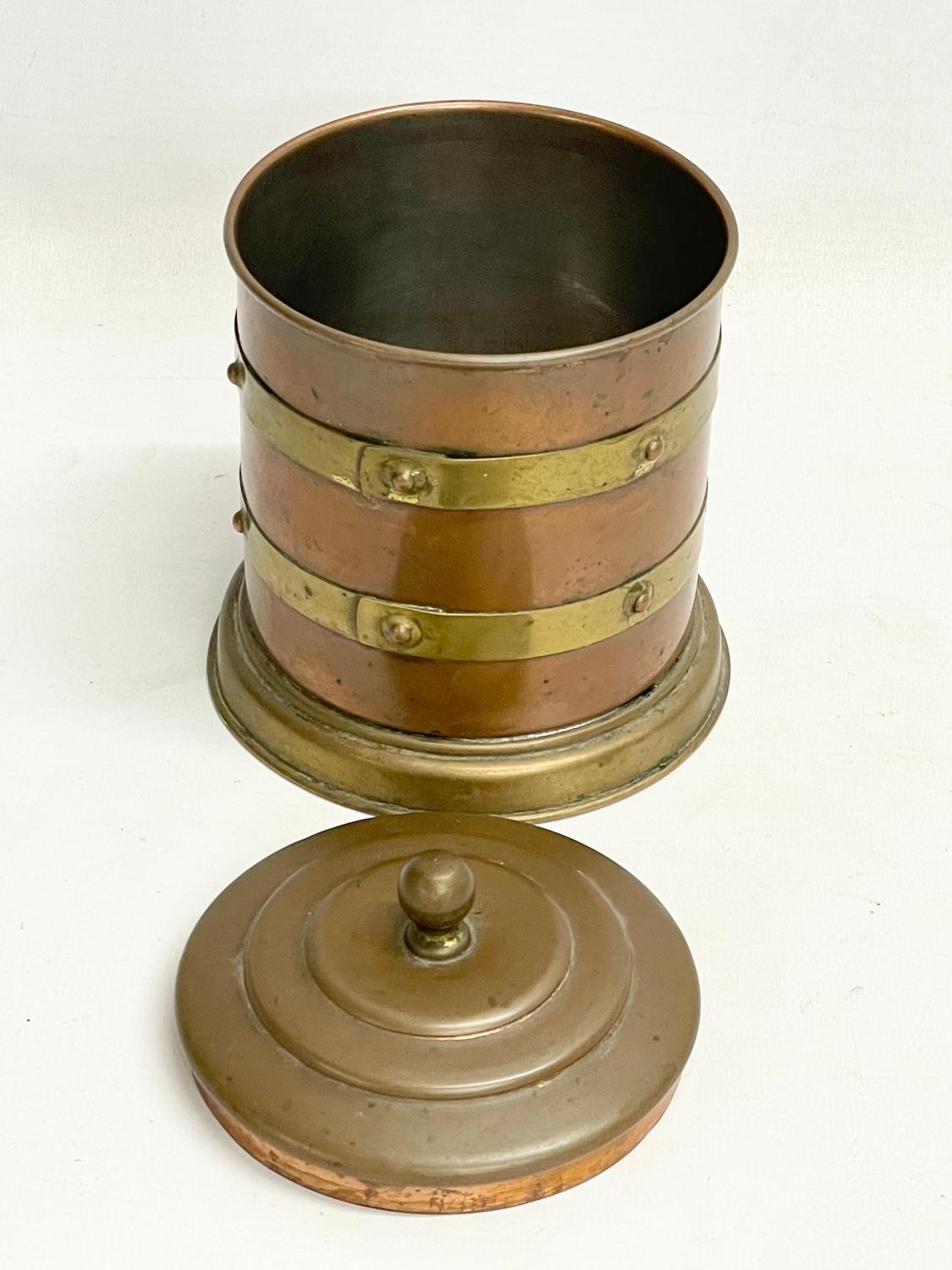 An early 20th century copper and brass tobacco tin. 12x16cm - Image 2 of 3