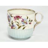 A Victorian hand painted moustache tea cup. 11.5x8.5cm.