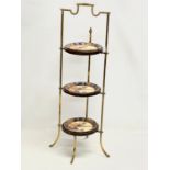 A large good quality Edwardian brass and mahogany cake stand. 35x82cm