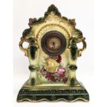 An ornate pottery mantle clock. 23x10x31cm