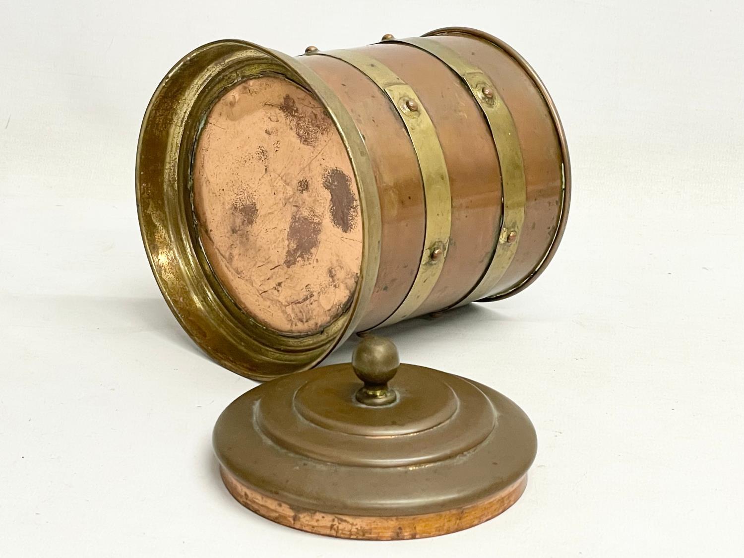 An early 20th century copper and brass tobacco tin. 12x16cm - Image 3 of 3