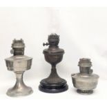 A Victorian oil lamp with glass funnel, with 2 other Aladdin lamps. Victorian lamp measures 48cm