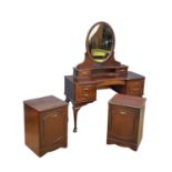 A 3 piece mahogany bedroom suite. A pair of bedsides and matching dressing table