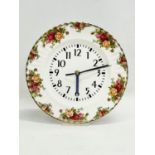 A Royal Albert Old Country Roses clock on stand. 26cm
