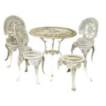 A vintage cast alloy Victorian style garden table and 3 chairs, with matching stool. 79x68cm