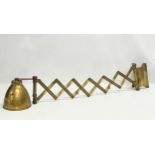 A large vintage brass wall scissor spring lamp. Full extended 97cm. Closed 30cm
