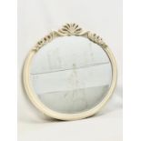 An ornate bevelled mirror. 72x67cm