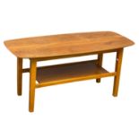 A Mid Century teak and beech coffee table. 95x41.5x43cm.