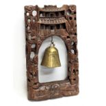 An ornate early 20th century carved Box wood frame with bell. 23x42cm