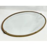 An early 20th century brass framed mirror. Circa 1910-1920. 70x42cm.