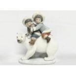 A Lladro figurine ‘Eskimo Riders’ 14x17.5cm.